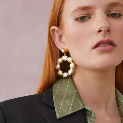 Ashiana London Wanda Pearl Earrings: Statement gold and freshwater pearl hoop earrings on model with red hair
