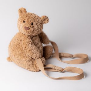 Front view of the Jellycat Bartholomew Bear Backpack showing brown ruffled fur and adjustable shoulder straps.