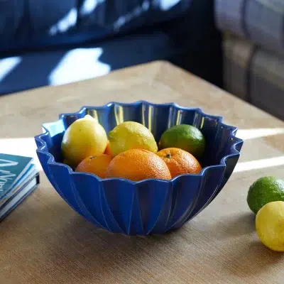 Gurgly Etoile fluted bowl in Azure blue lifestyle image with fruit