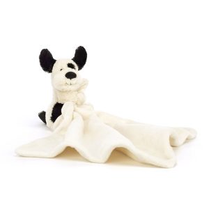 Jellycat Bashful Rufferty Black & Cream Puppy Soother sitting with blanket