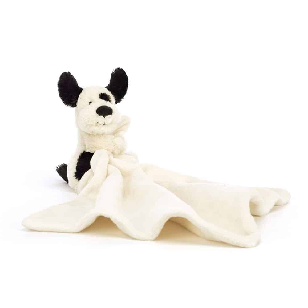 Jellycat Bashful Rufferty Black & Cream Puppy Soother sitting with blanket