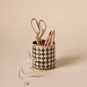 a-dopo-black-white-wavy-storage-tin in use as desk tidy