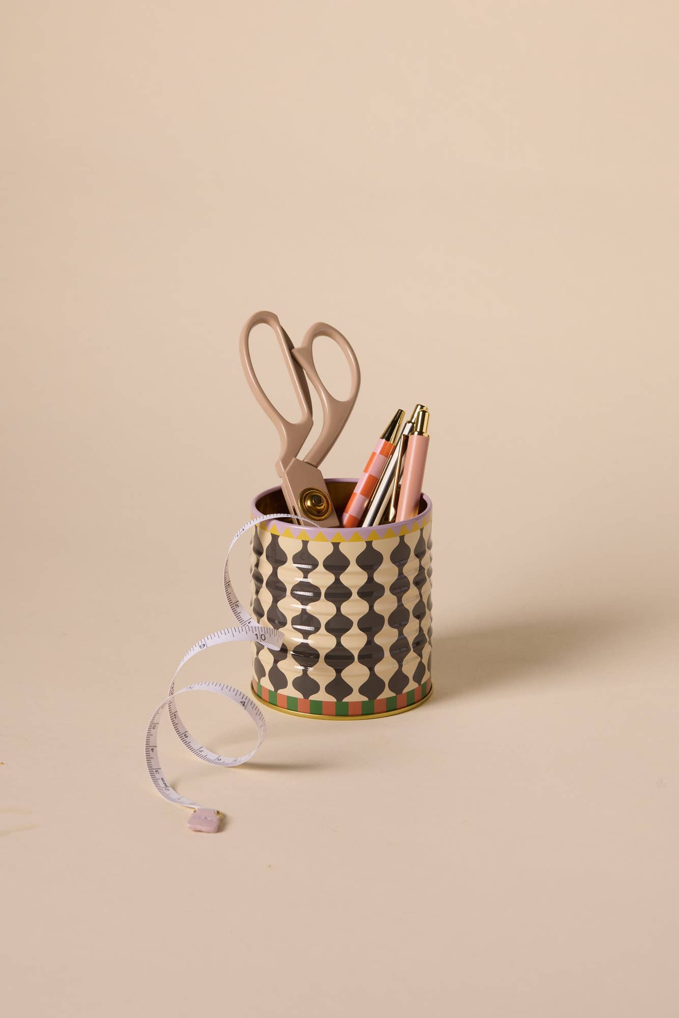 a-dopo-black-white-wavy-storage-tin in use as desk tidy